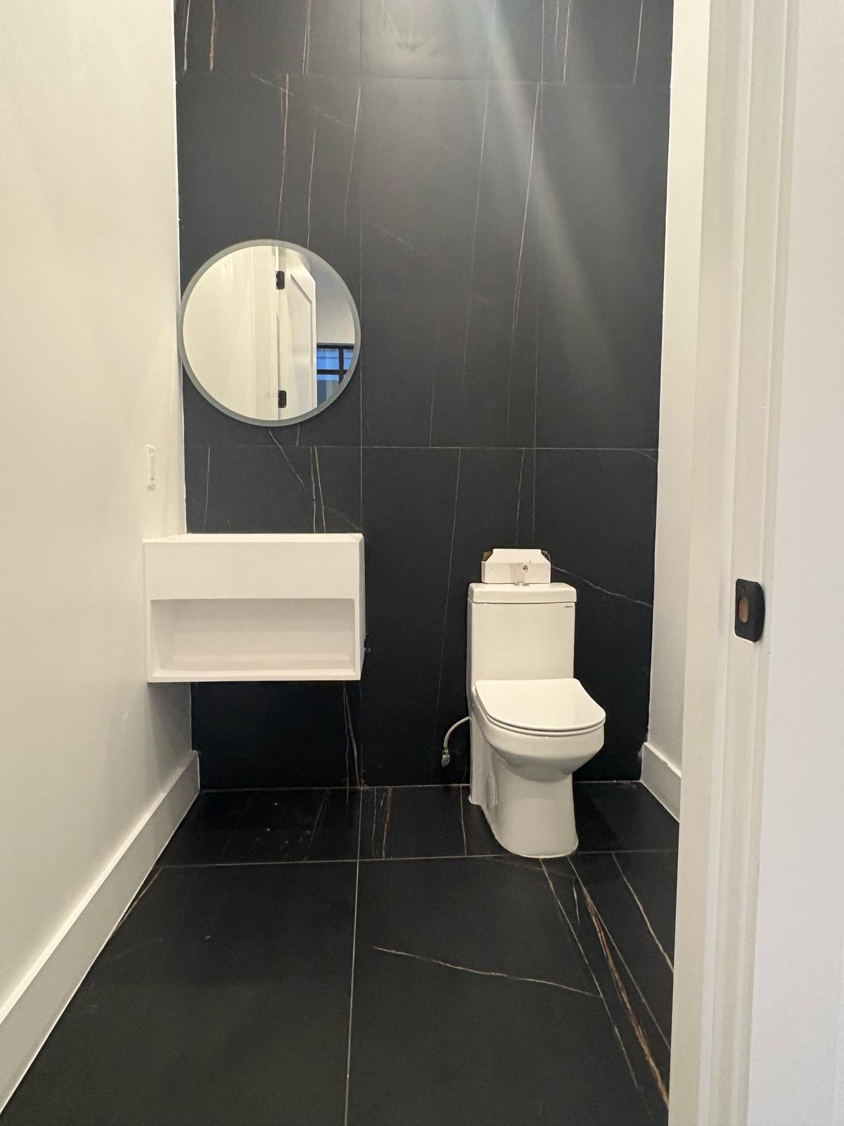 97 Seigel Street, Unit COMM Brooklyn, NY 11206 - Photo 5 of 7 a bathroom with a toilet a sink and a mirror