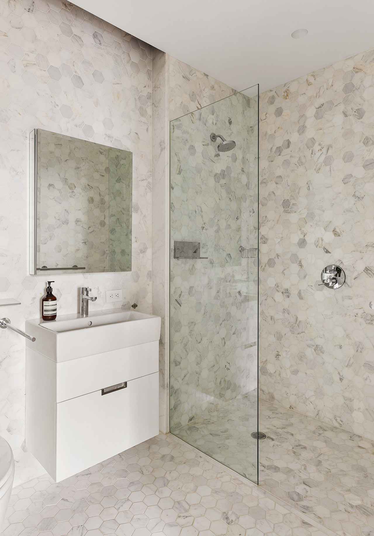 325 West Broadway, Unit 7B Manhattan, NY 10013 - Photo 14 of 21 a bathroom with a sink a mirror and a shower