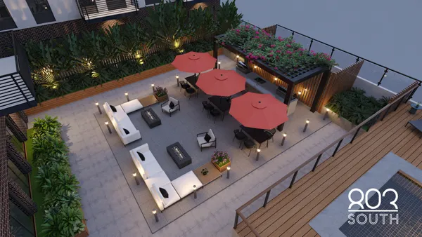 an aerial view of house with yard swimming pool and outdoor seating