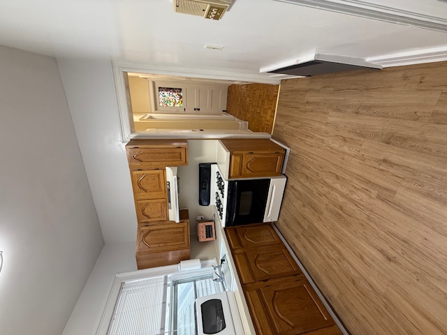1587 East 18th Street, Unit 2 Brooklyn, NY 11230 - Photo 7 of 13 a kitchen with a stove a sink and a refrigerator