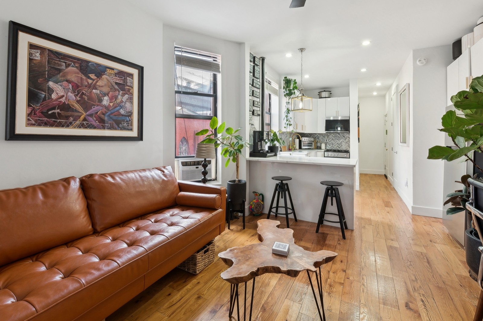 66 West 138th Street, Unit 3A Manhattan, NY 10037 - Photo 1 of 8 a living room with furniture and wooden floor