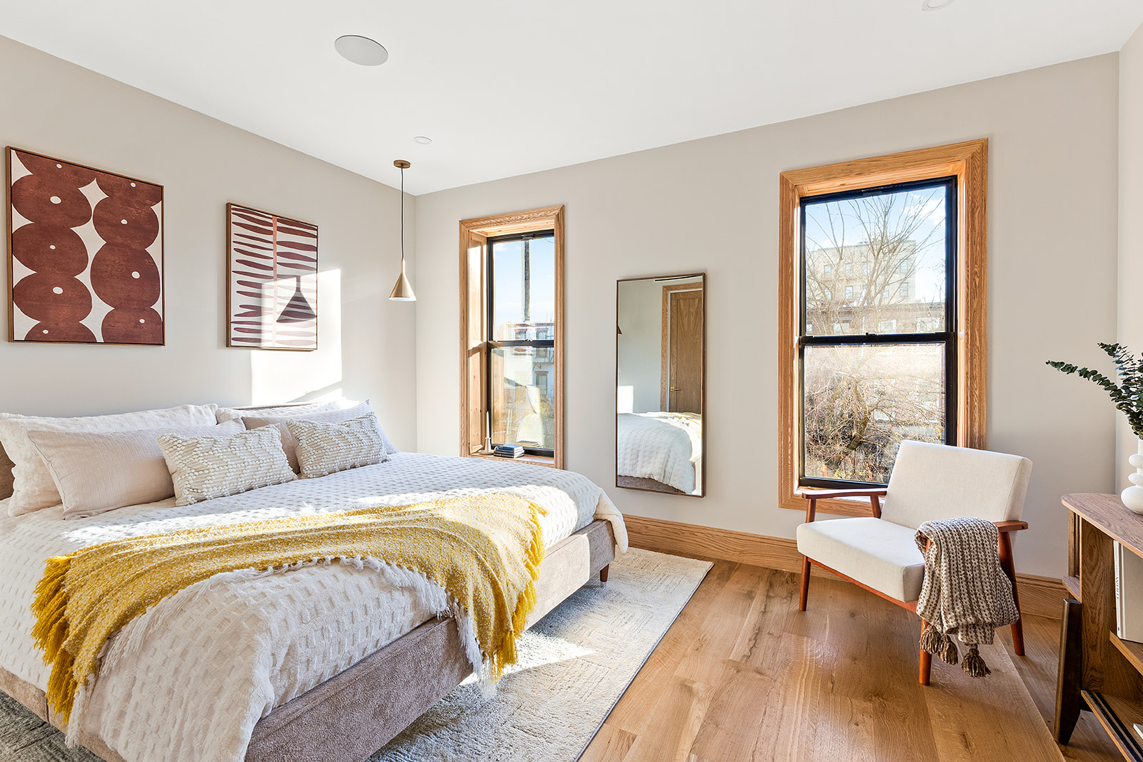 1220 Dean Street Brooklyn, NY 11216 - Photo 6 of 19 a spacious bedroom with a bed and wooden floor