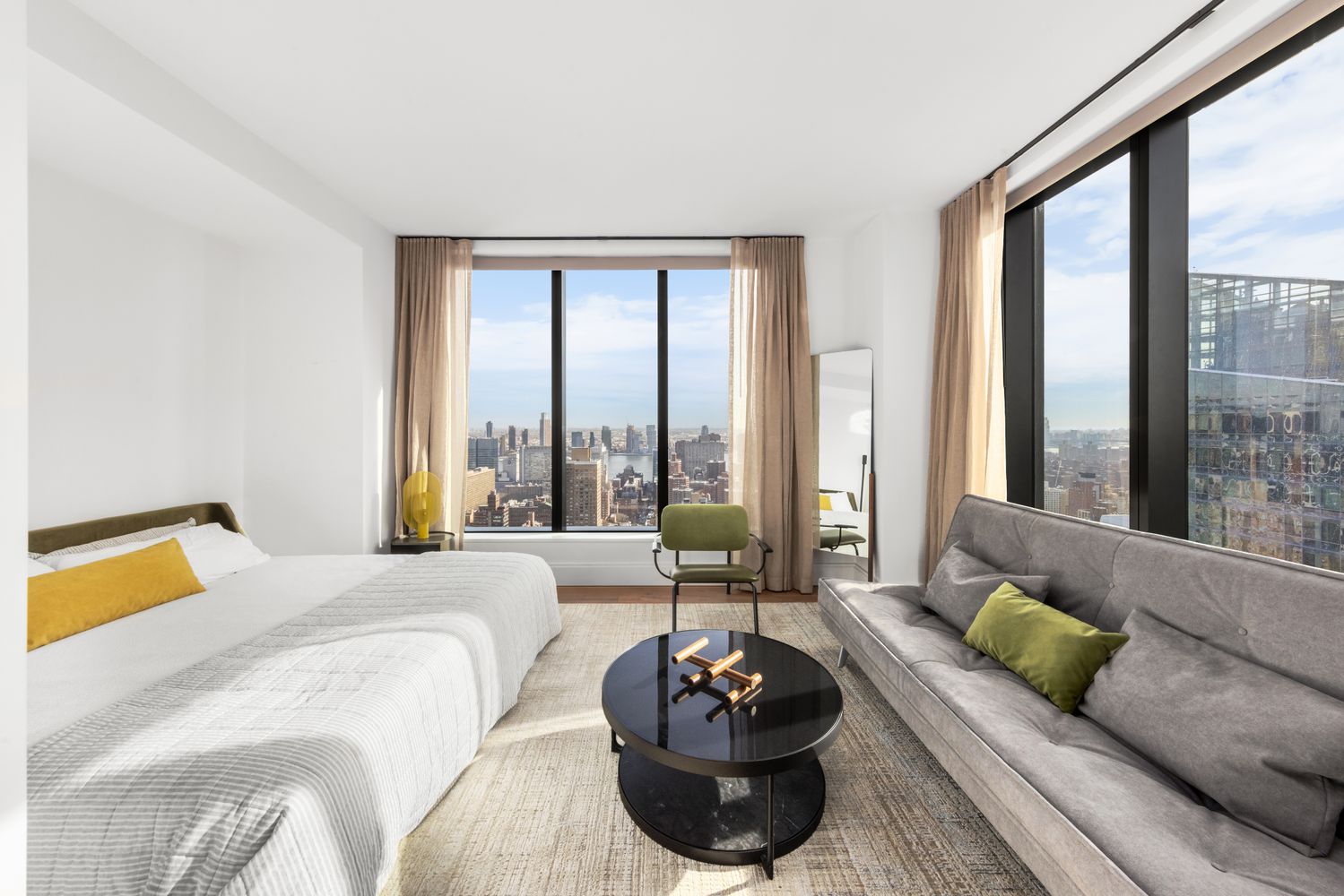 a bedroom with a bed and a large window