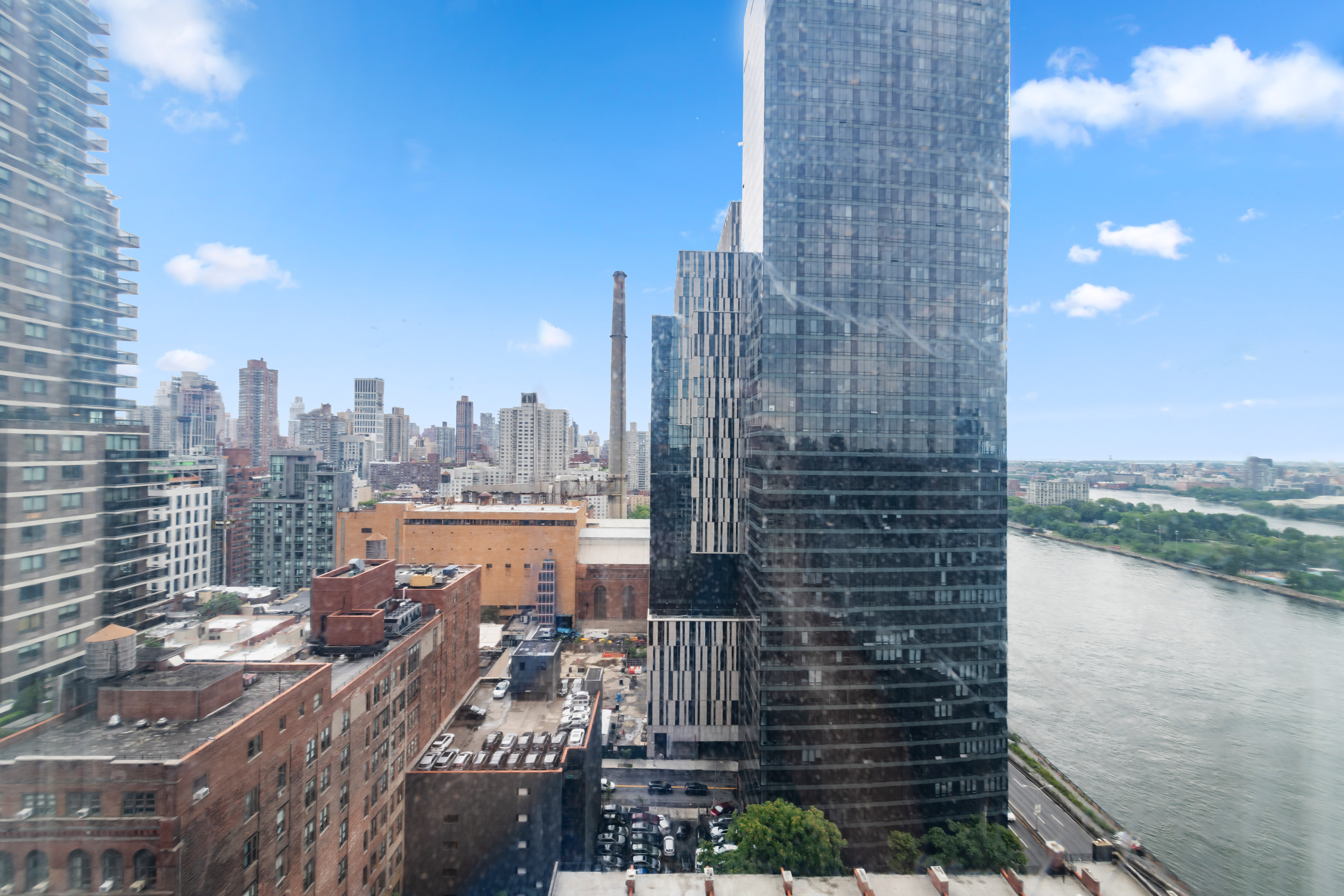 524 East 72nd Street, Unit 26A Manhattan, NY 10021 - Photo 10 of 16 a view of a city with a lake