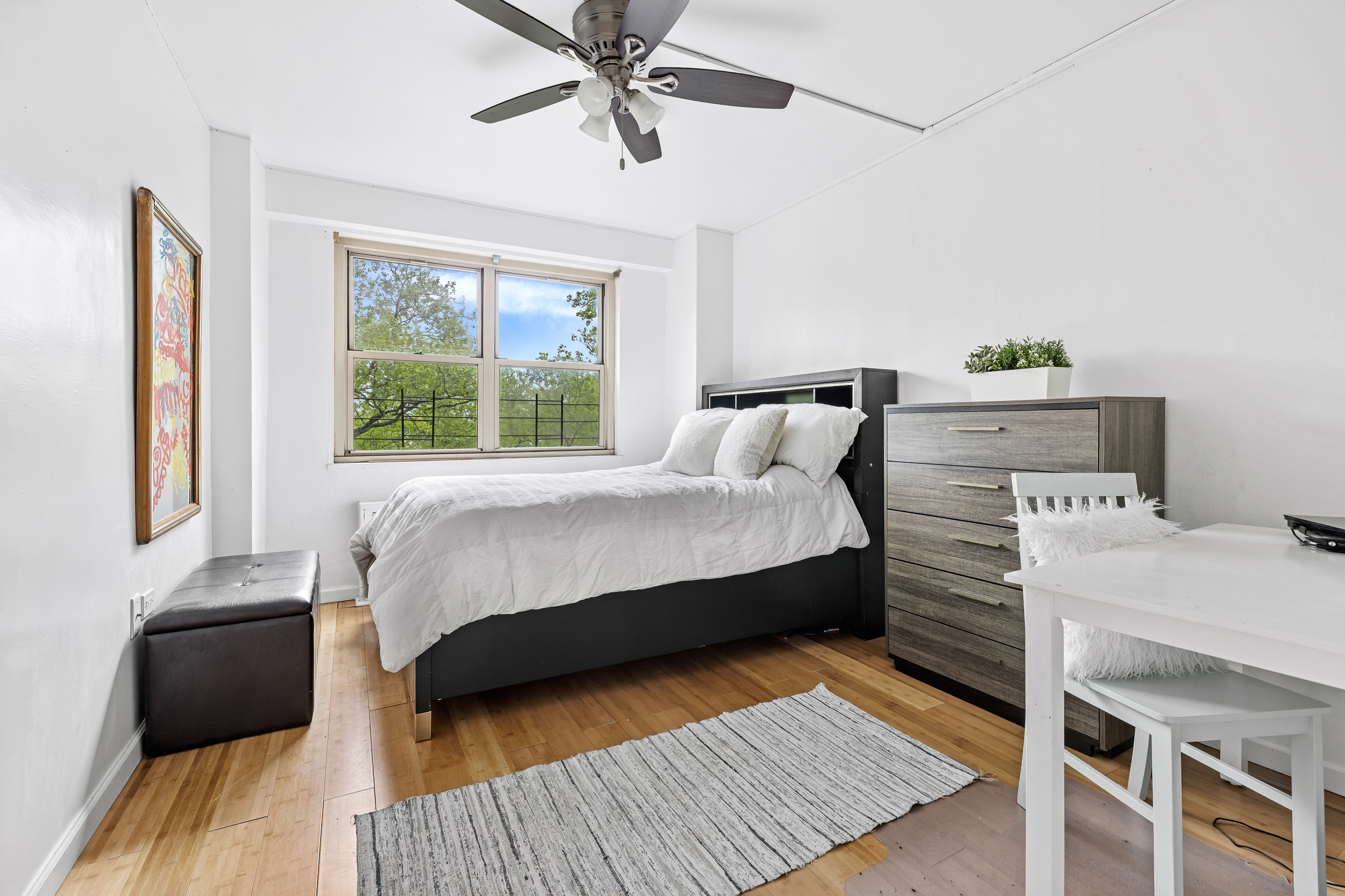 1065 Vermont Street, Unit 4L Brooklyn, NY 11207 - Photo 4 of 11 a bedroom with a bed and wooden floor