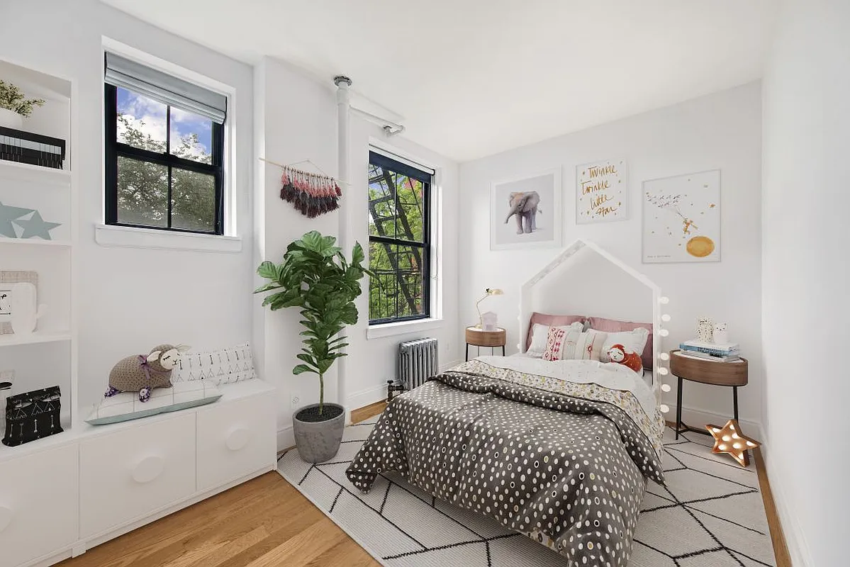 138 Baltic Street, Unit 3C Brooklyn, NY 11201 - Photo 7 of 10 a bedroom with a bed and wooden floor