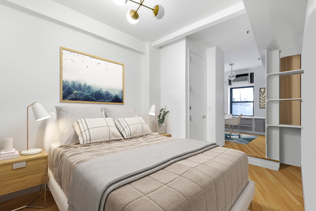 161 Remsen Street, Unit 2C Brooklyn, NY 11242 - Photo 7 of 13 a bedroom with a large bed and a chandelier