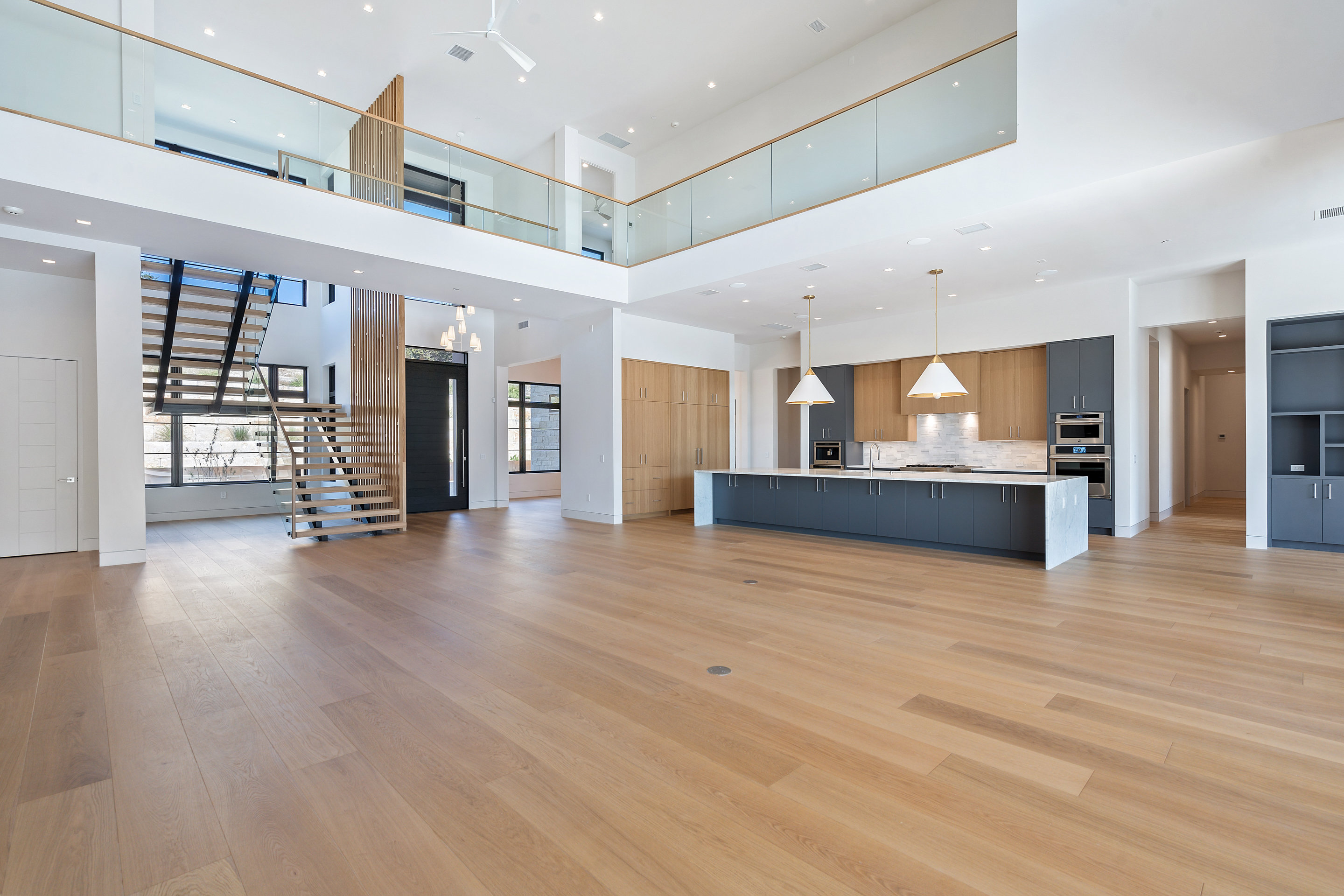 1905 Hallam Drive Austin, TX 78746 - Photo 9 of 39 a view of a kitchen with a sink and a refrigerator