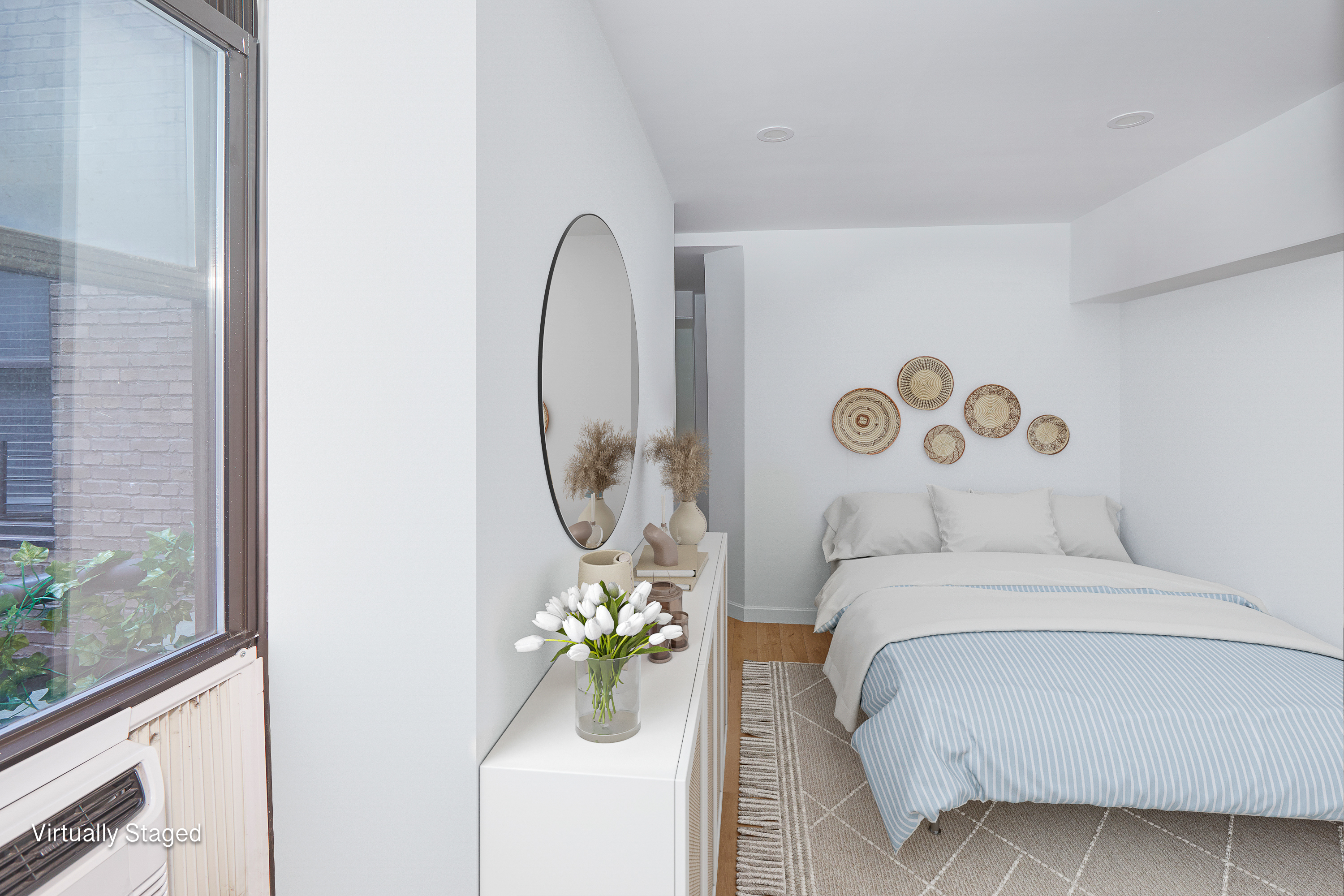 150 West 51st Street, Unit 1528 Manhattan, NY 10019 - Photo 3 of 21 a bedroom with a bed and a window