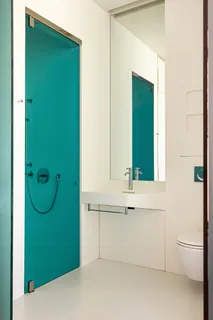 a bathroom with a bathtub and a mirror