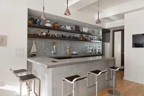 a kitchen with stainless steel appliances granite countertop a sink and a stove