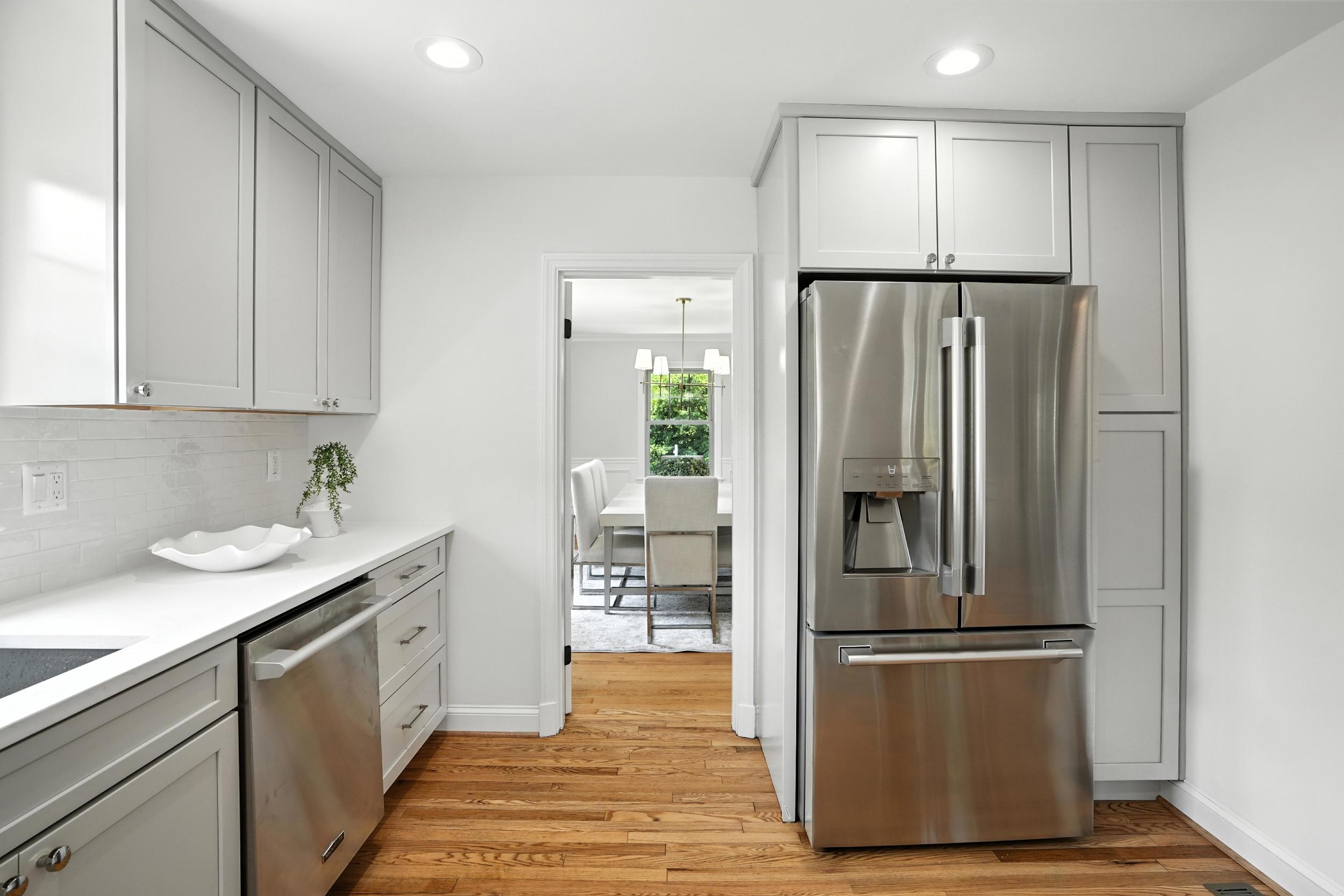 4505 Park Road Alexandria, VA 22312 - Photo 25 of 80 a kitchen with a refrigerator sink and cabinets