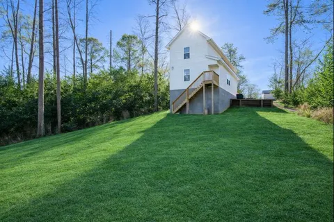 a backyard of a house with lots of green space