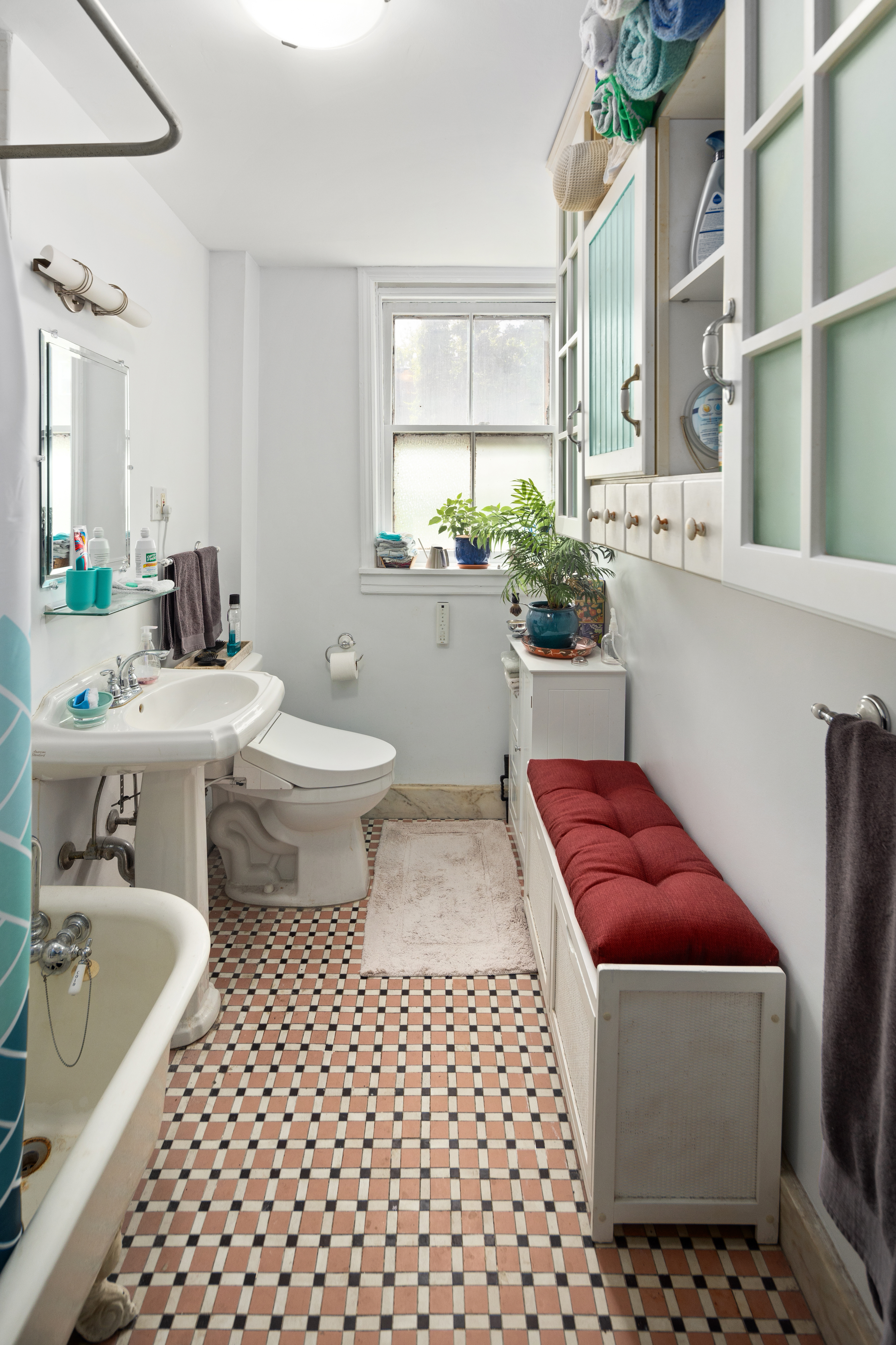 212 Adelphi Street Brooklyn, NY 11205 - Photo 6 of 11 a bathroom with a sink toilet and mirror