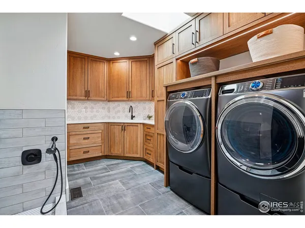 a view of a kitchen with a washer and dryer