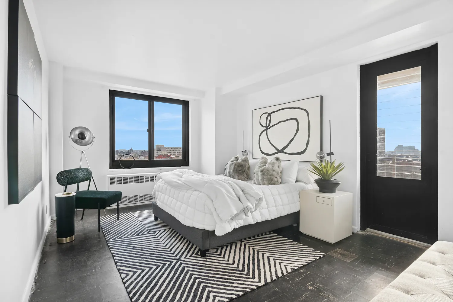 a living room with a bed furniture and a window