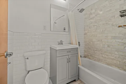 a bathroom with a sink toilet and vanity