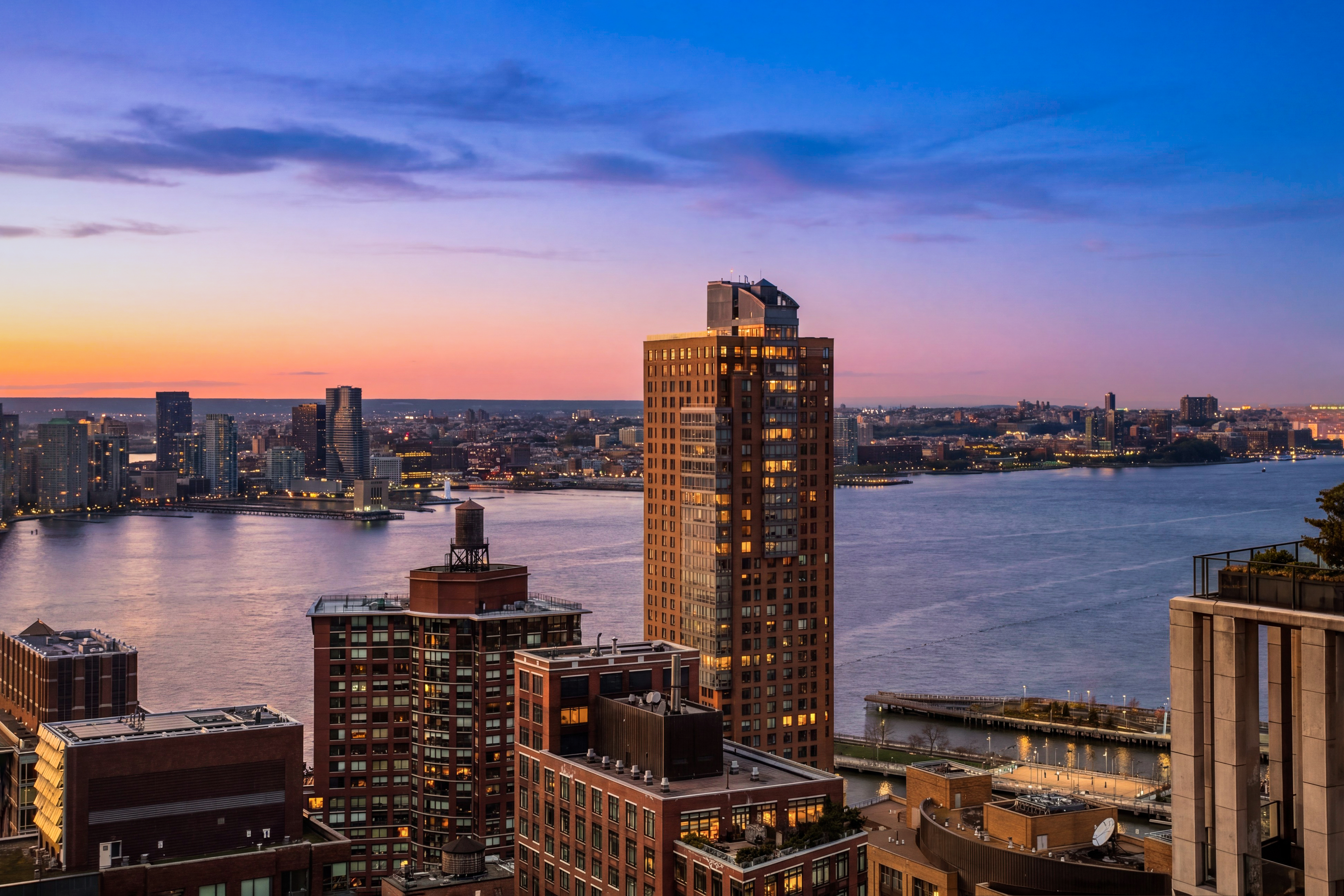 111 Murray Street, Unit 35A Manhattan, NY 10007 - Photo 12 of 38 a view of a lake with a city skyline in the background