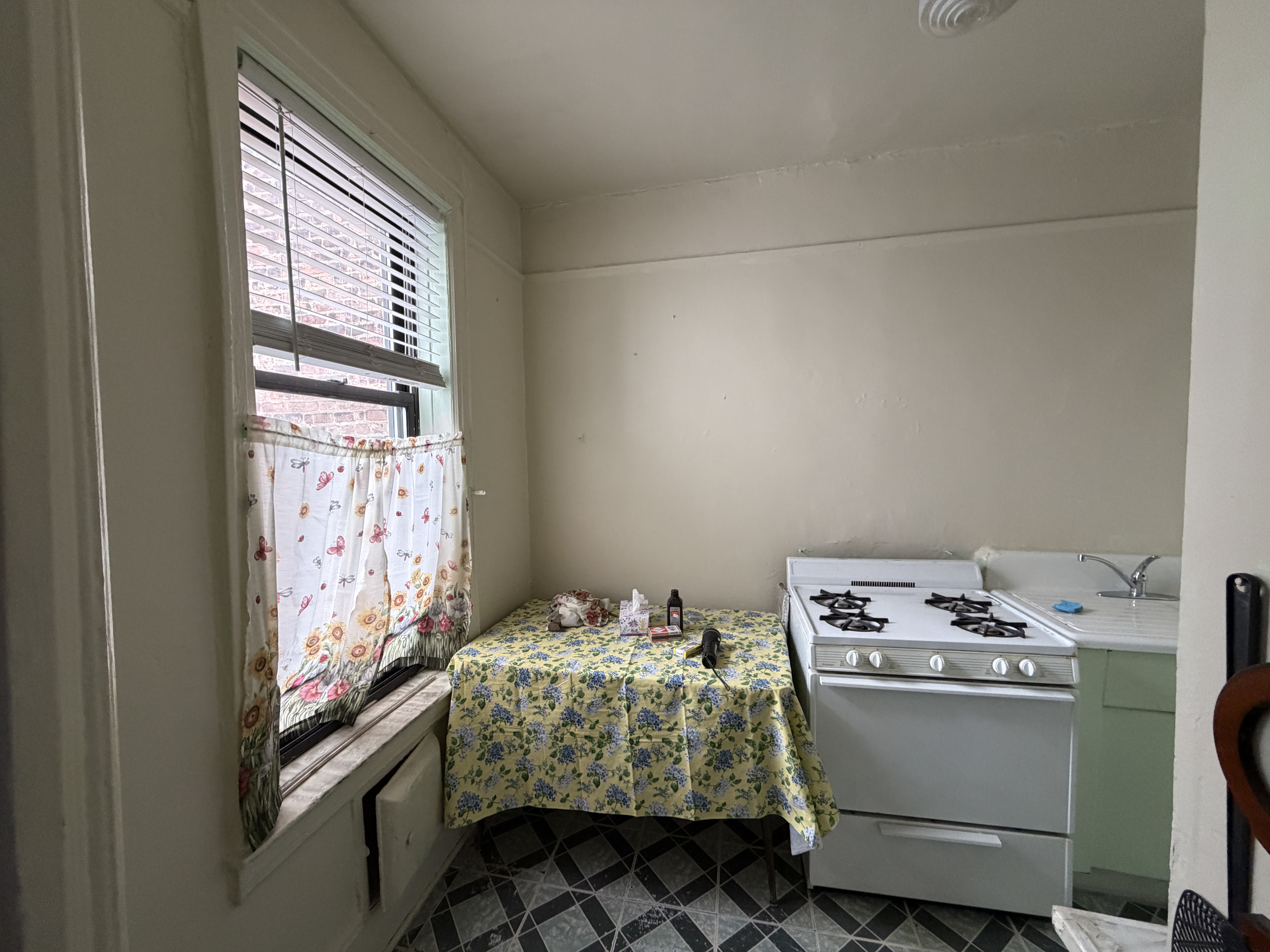 426 68th Street Brooklyn, NY 11220 - Photo 9 of 13 a room with storage and utility