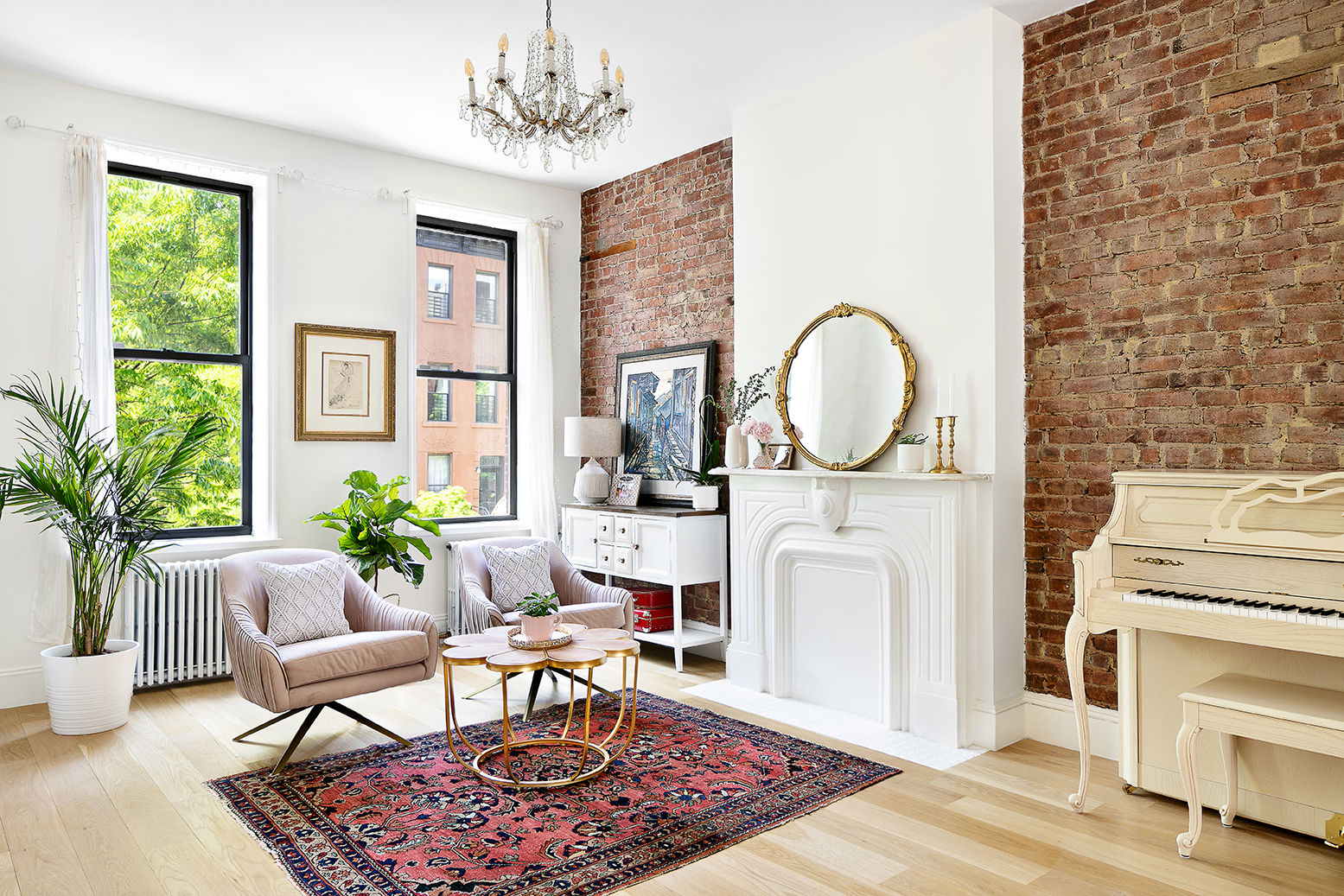 a living room with furniture a clock and a fireplace