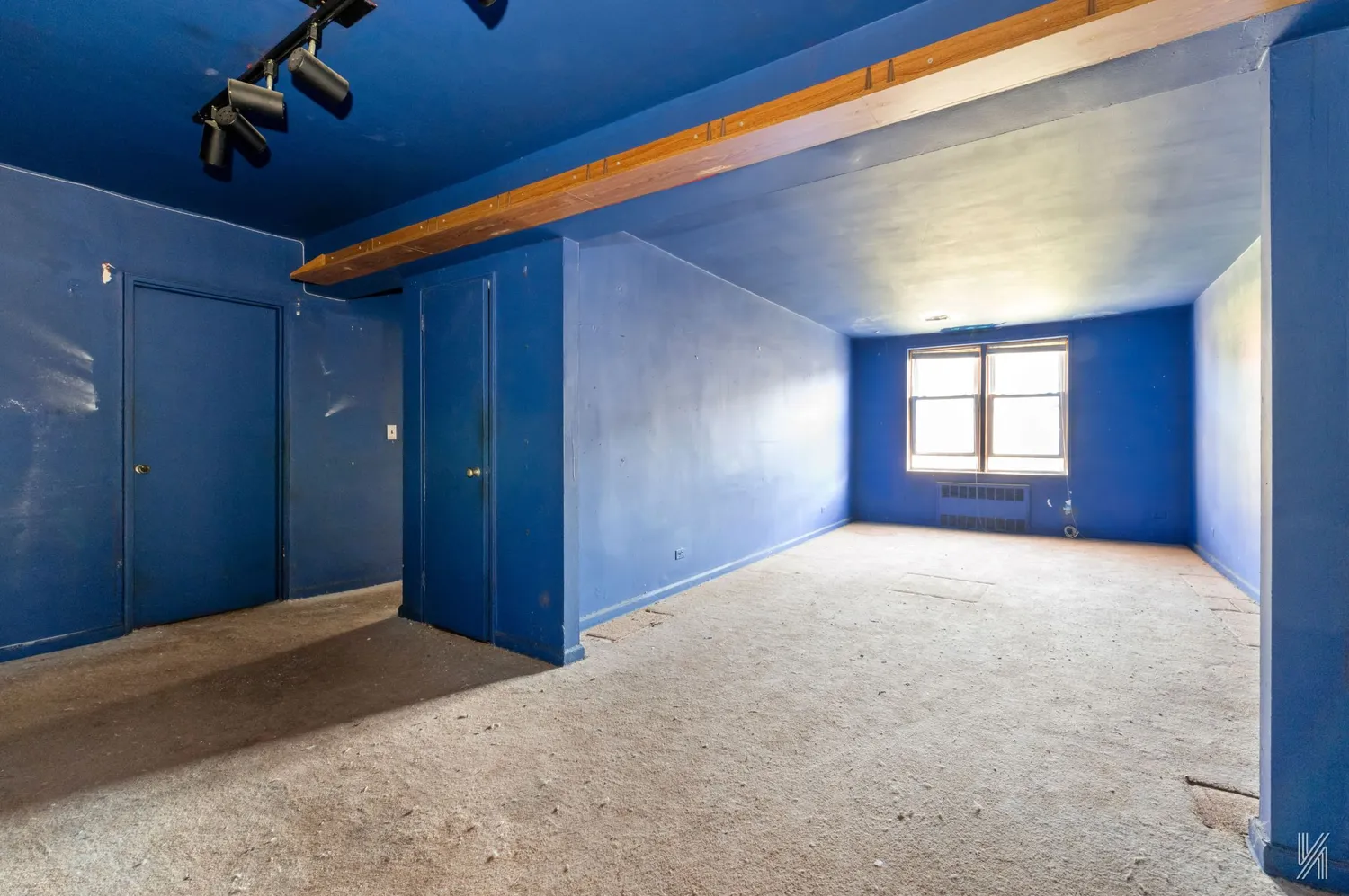 an empty room with windows