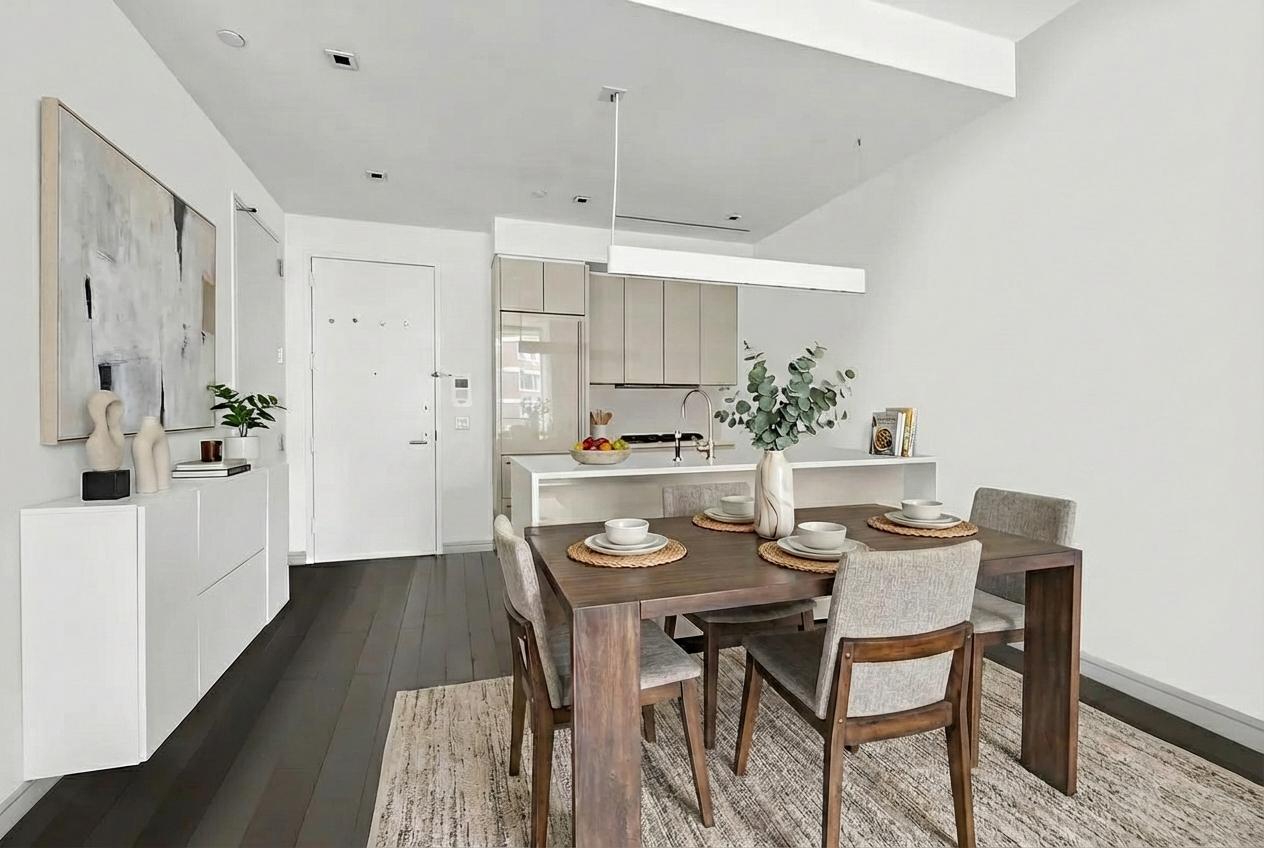 300 East 23rd Street, Unit 5B Manhattan, NY 10010 - Photo 5 of 10 a view of a dining room with furniture and wooden floor