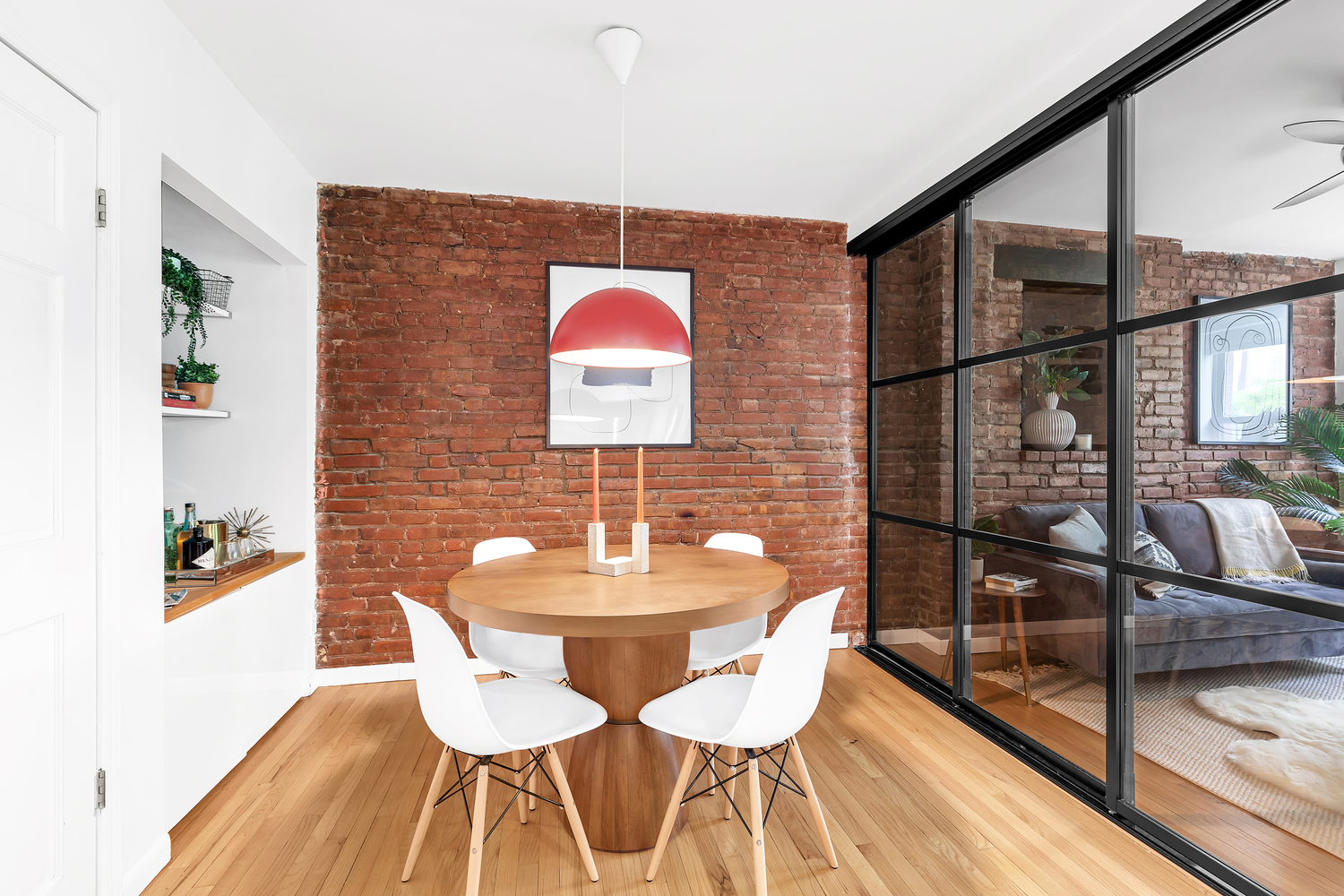 118 Suffolk Street, Unit 3A Manhattan, NY 10002 - Photo 3 of 8 a dining room with furniture and wooden floor
