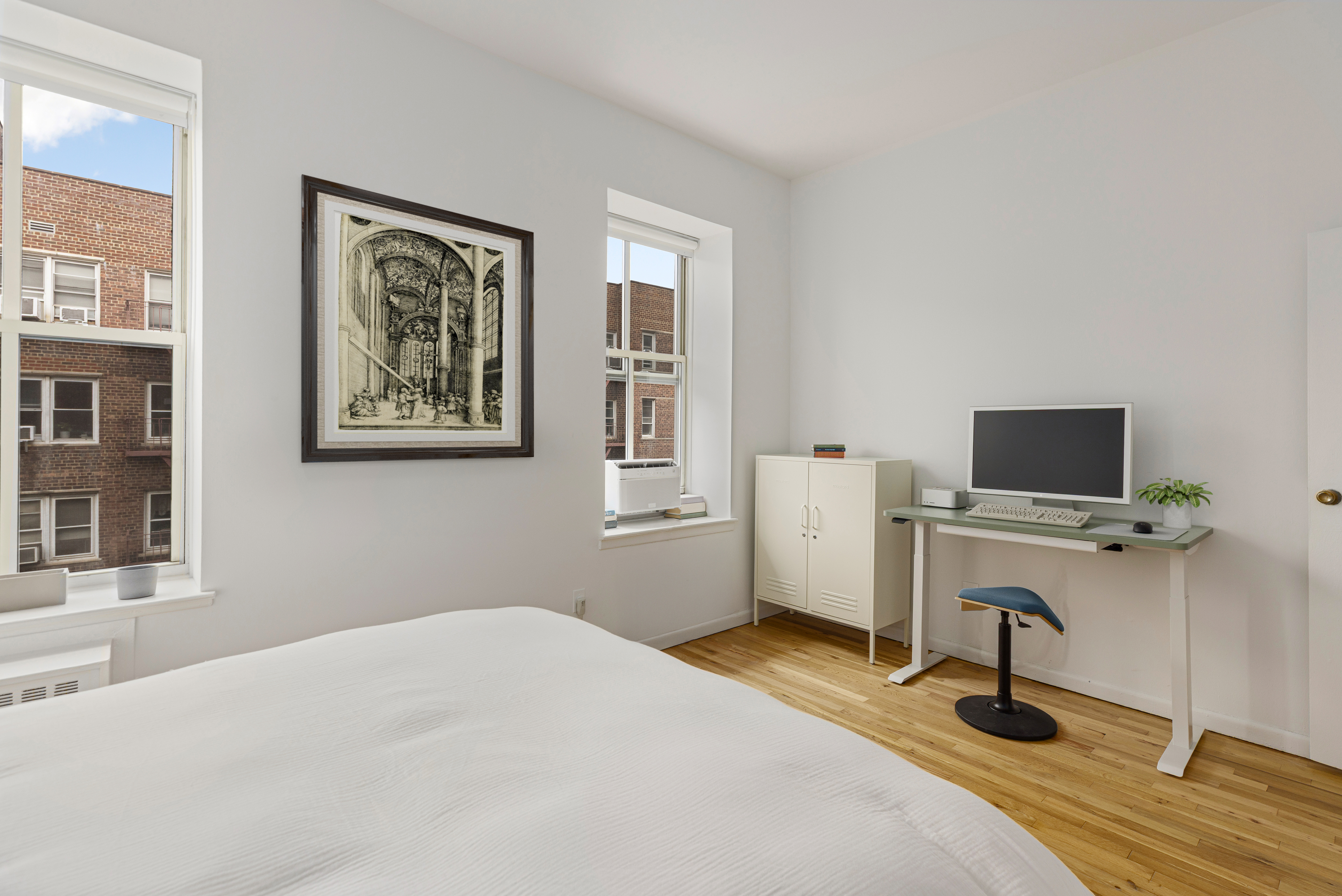 99 Bank Street, Unit 4R Manhattan, NY 10014 - Photo 6 of 15 a bedroom with a workspace