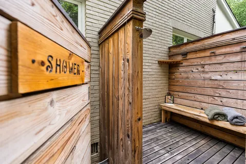 a bathroom with a sink toilet tub and shower