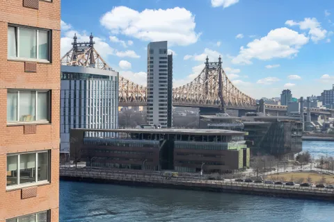 a view of a lake with a tall building