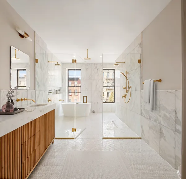 a kitchen with stainless steel appliances a refrigerator sink and stove