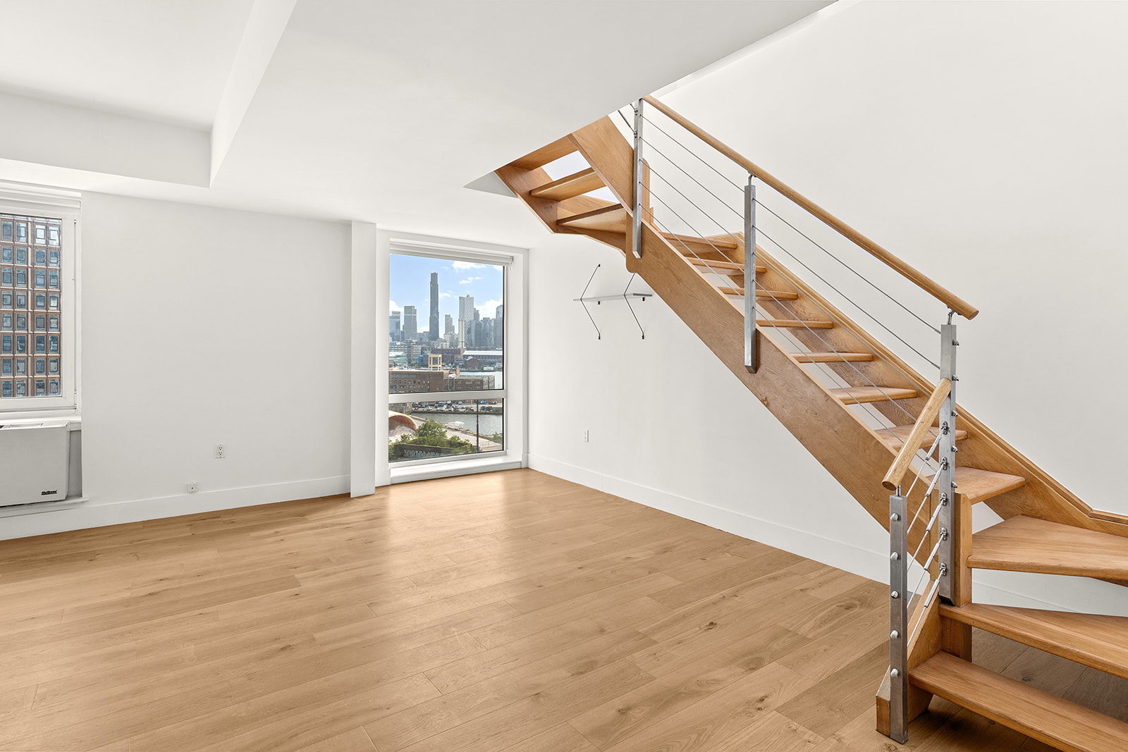 446 Kent Avenue, Unit PHC Brooklyn, NY 11249 - Photo 3 of 22 a view of entryway and hall with wooden floor