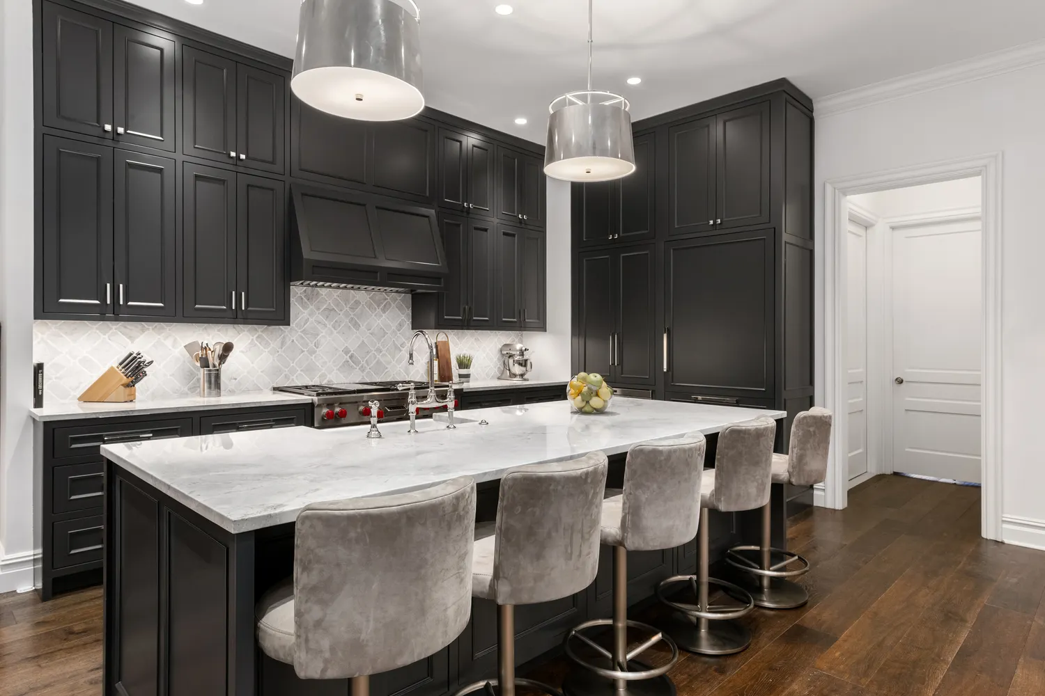 a kitchen with a dining table and chairs