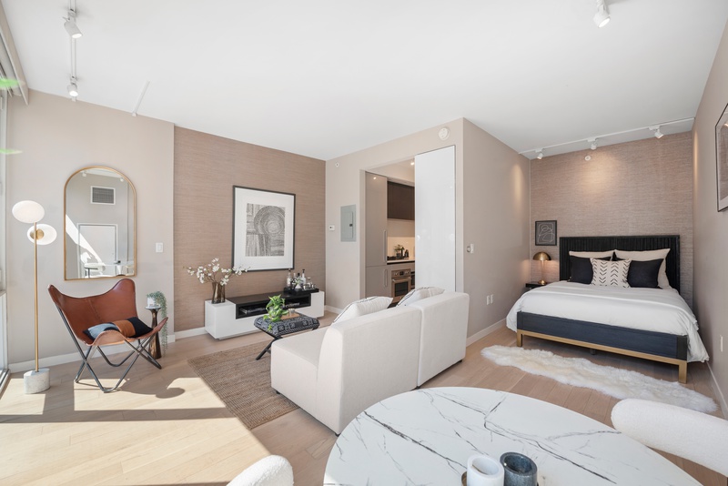 540 West 49th Street, Unit 609N Manhattan, NY 10019 - Photo 5 of 10 a living room with furniture and wooden floor