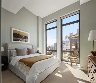 a bathroom with a sink shower and mirror