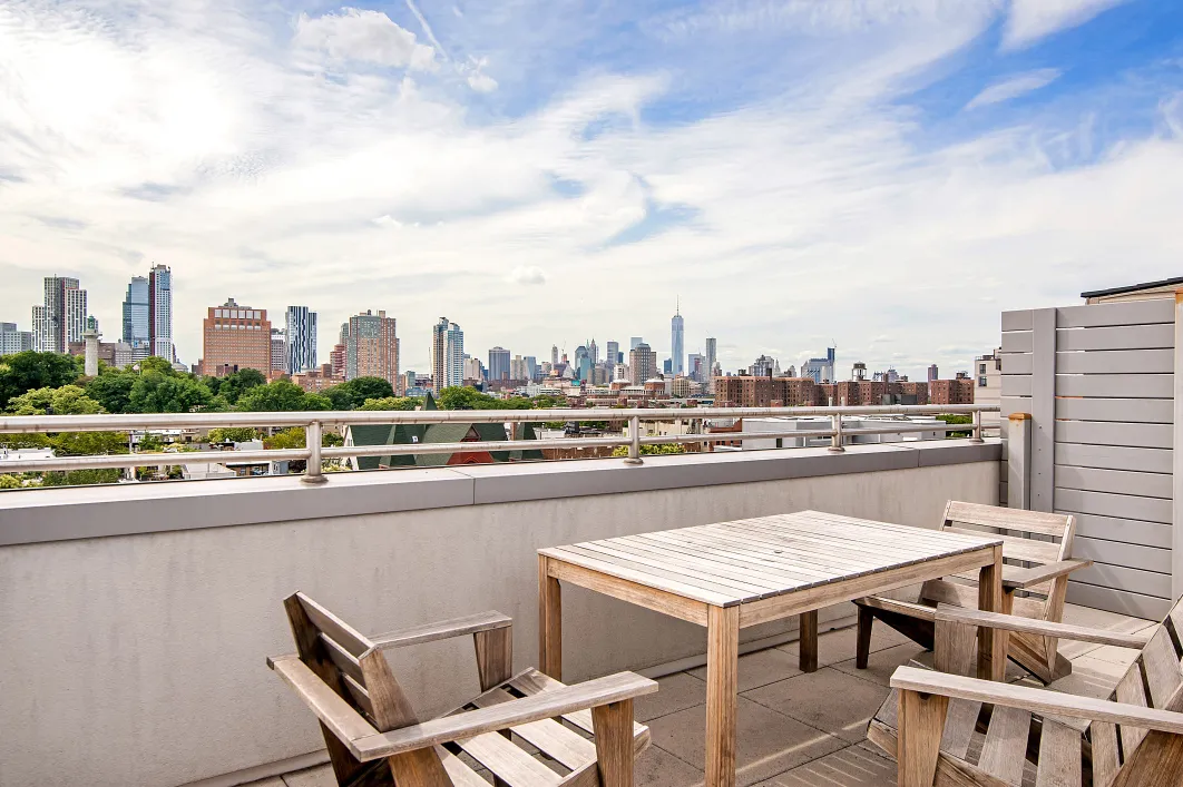 a terrace with a city view