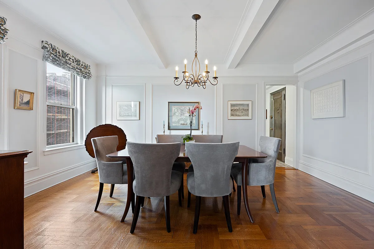 415 Central Park West, Unit 6A Manhattan, NY 10025 - Photo 10 of 25 a view of a dining room with furniture wooden floor and chandelier