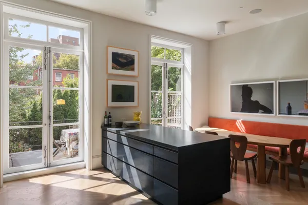 a room with furniture and large windows