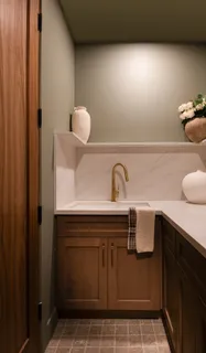 a bathroom with a sink and cabinets