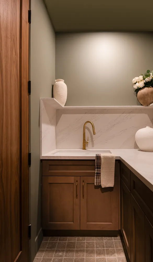 a bathroom with a sink and cabinets