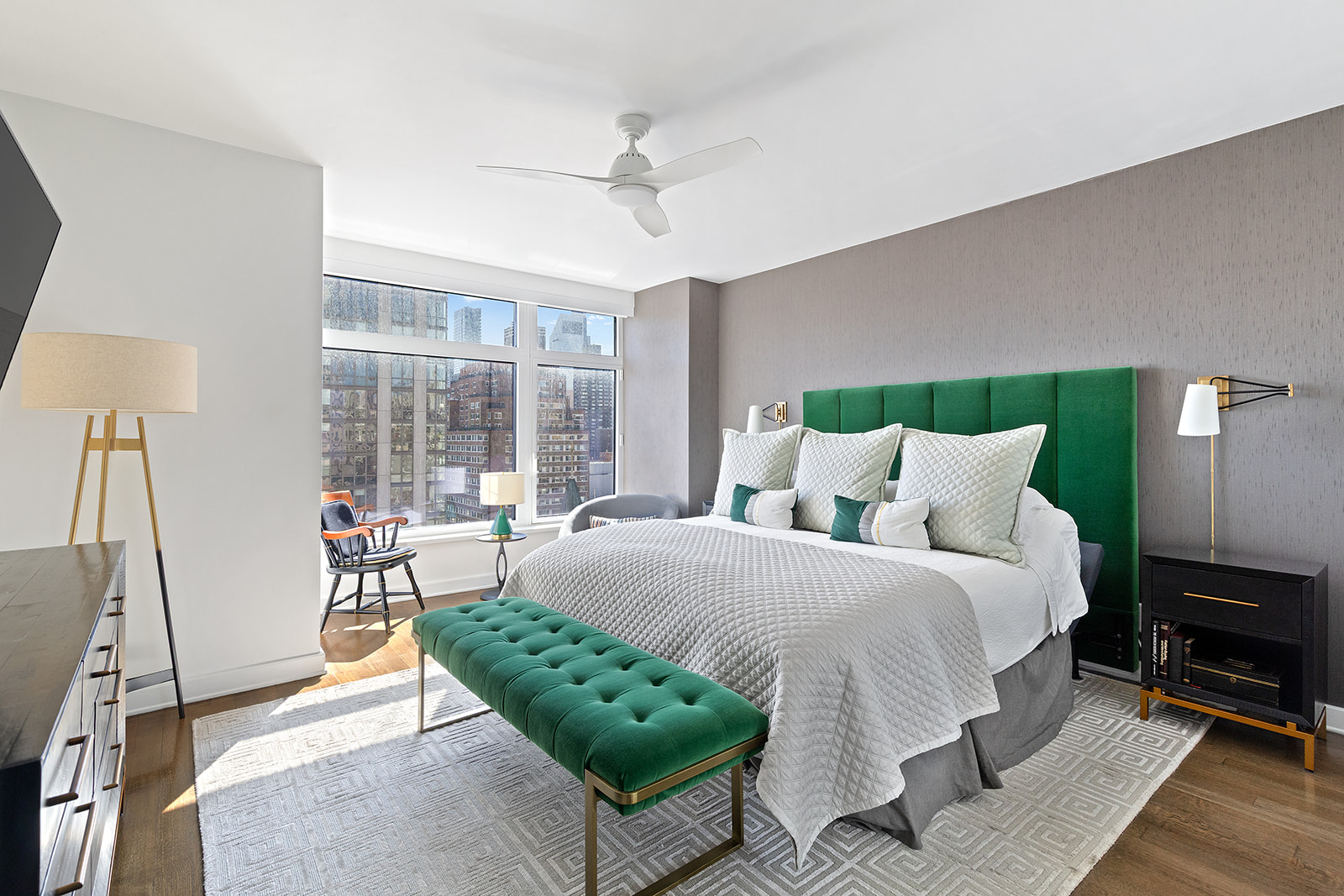 400 East 67th Street, Unit 12D Manhattan, NY 10065 - Photo 3 of 9 a bedroom with a bed a mirror and a large window