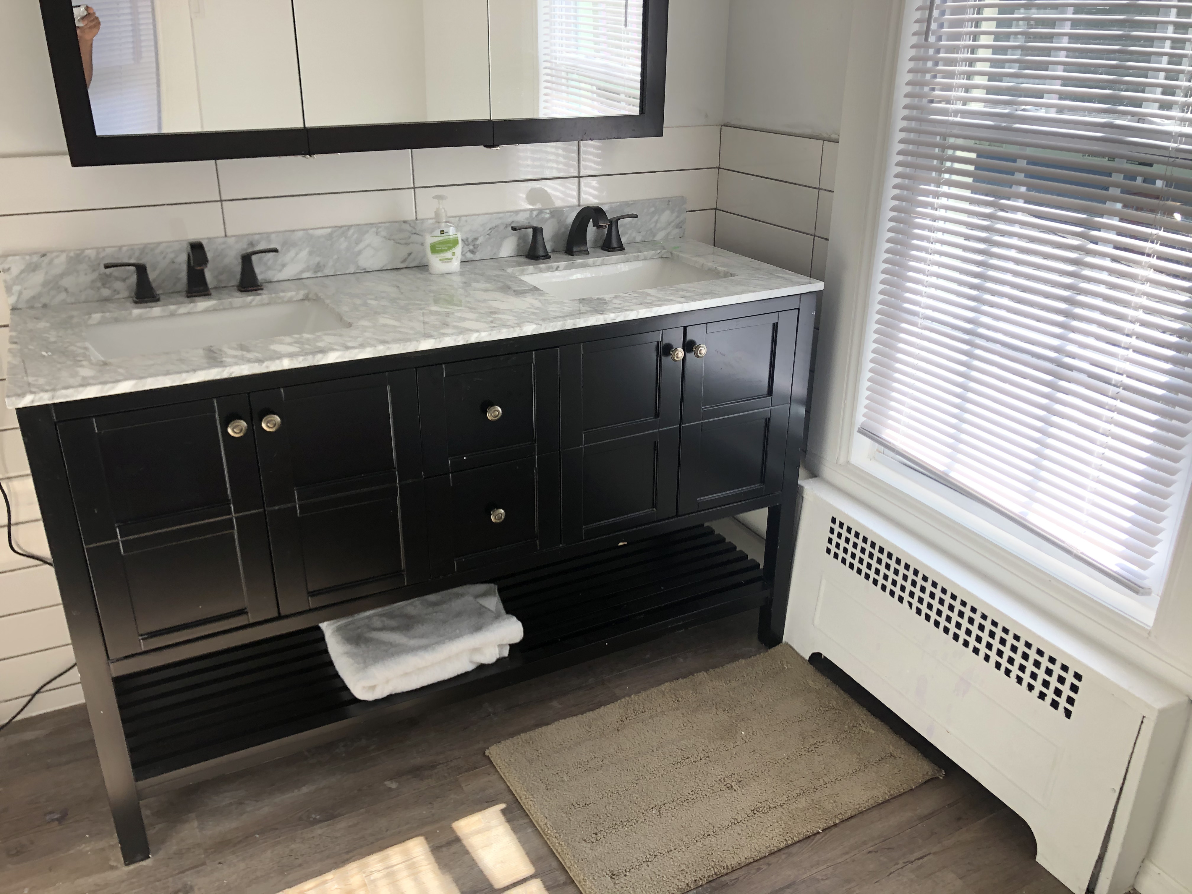 1112 Beverley Road Brooklyn, NY 11218 - Photo 30 of 53 a bathroom with a sink and a mirror