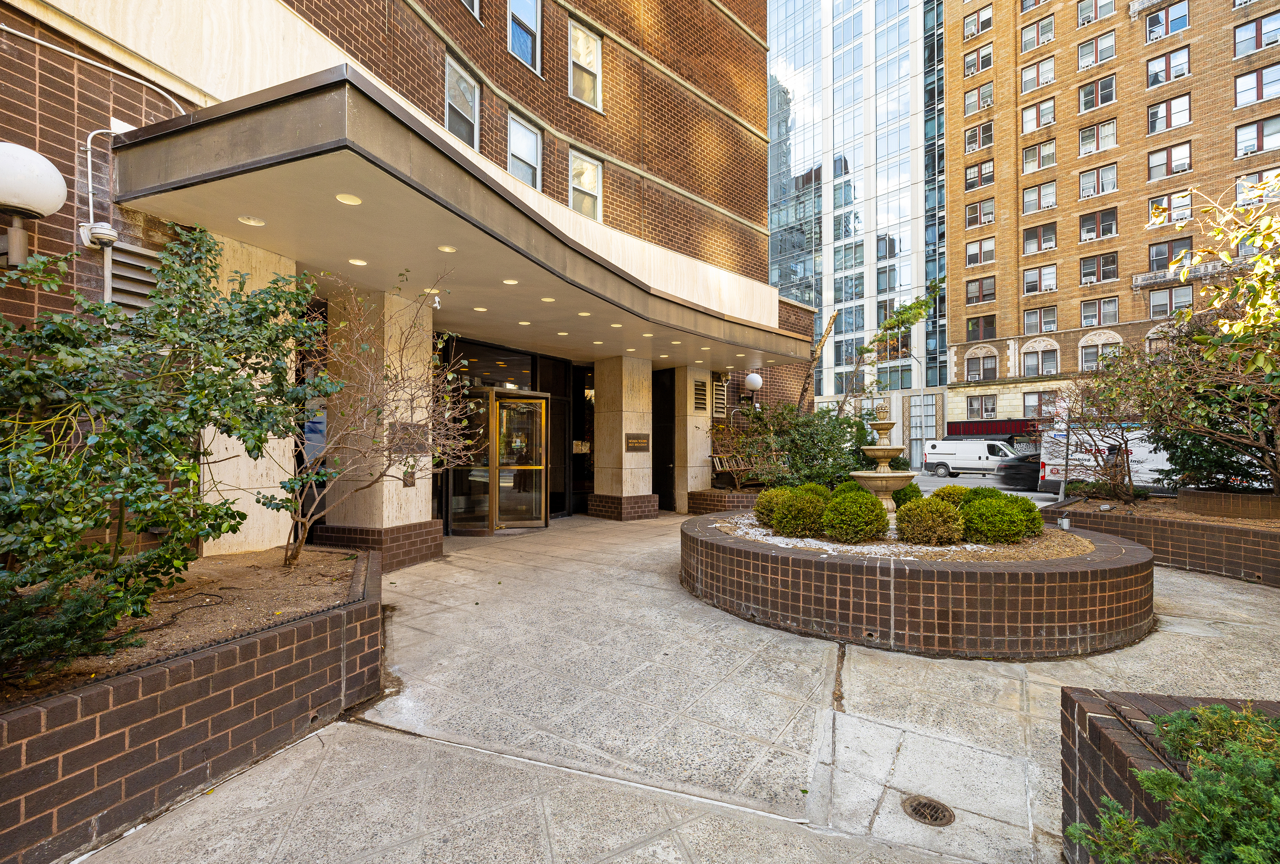 2025 Broadway, Unit 9F Manhattan, NY 10023 - Photo 10 of 11 a view of a house with a fountain and a patio