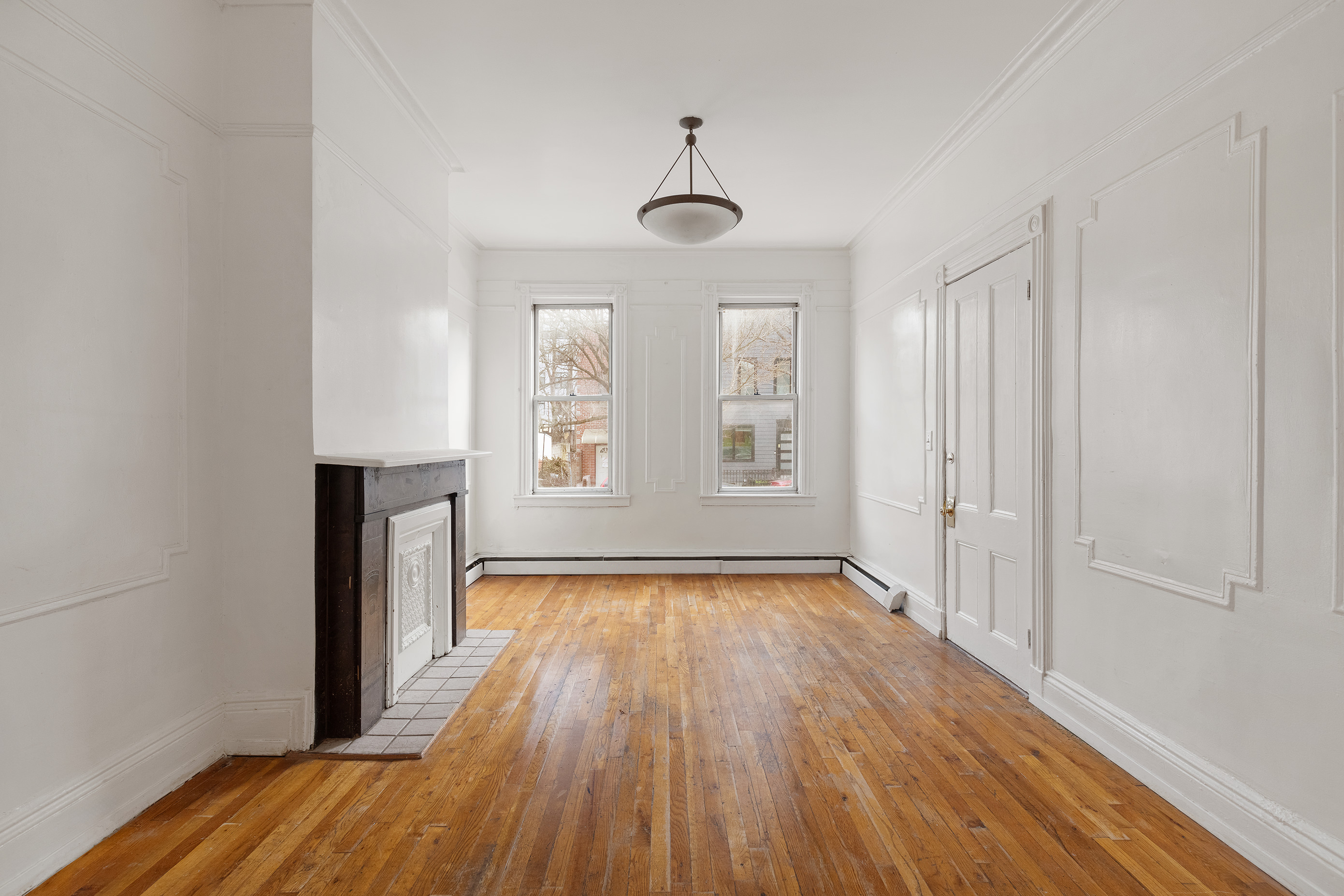 318 21st Street Brooklyn, NY 11215 - Photo 8 of 14 wooden floor in an empty room with a window