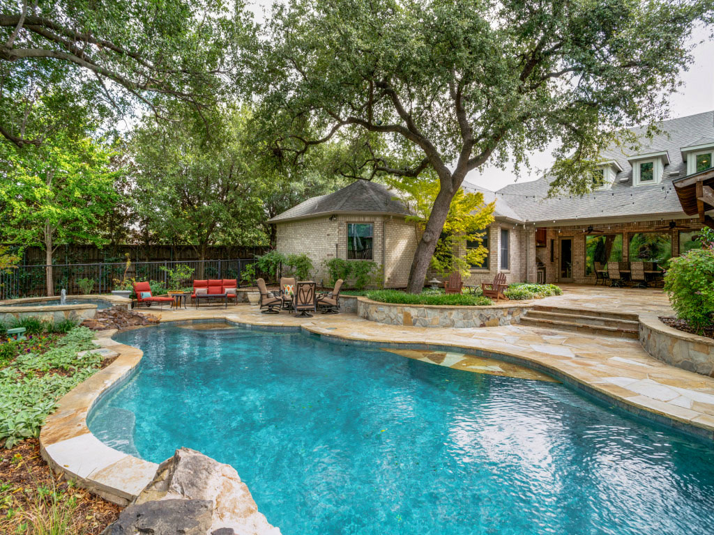 11503 West Ricks Circle Dallas, TX 75230 - Photo 35 of 39 a swimming pool view with a seating space and a garden view
