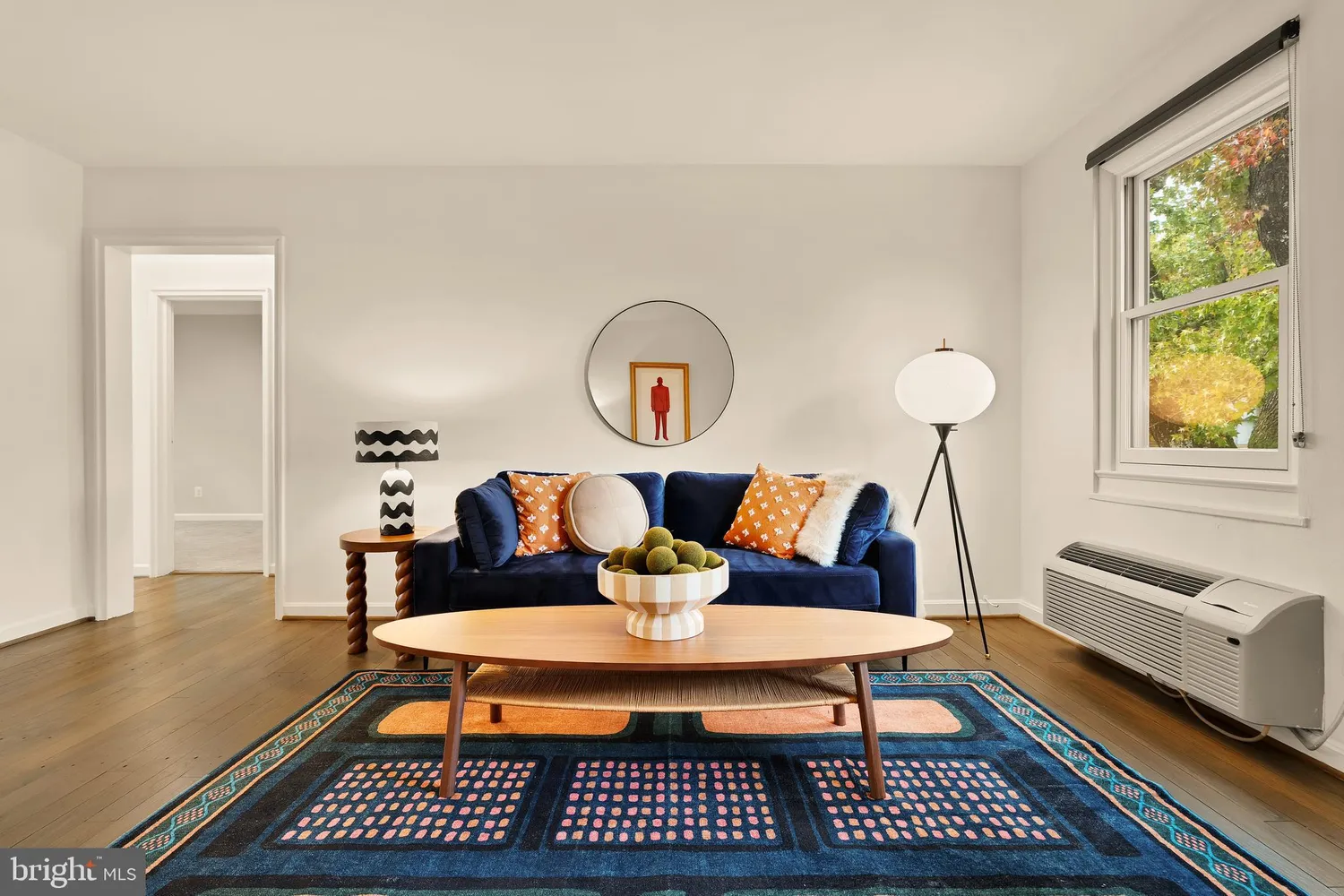 a living room with furniture and a window