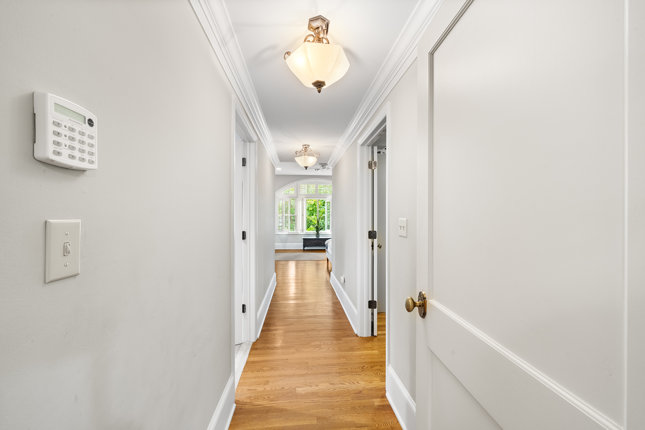 718 Arlington Road Narberth, PA 19072 - Photo 16 of 47 a view of a hallway with a chandelier