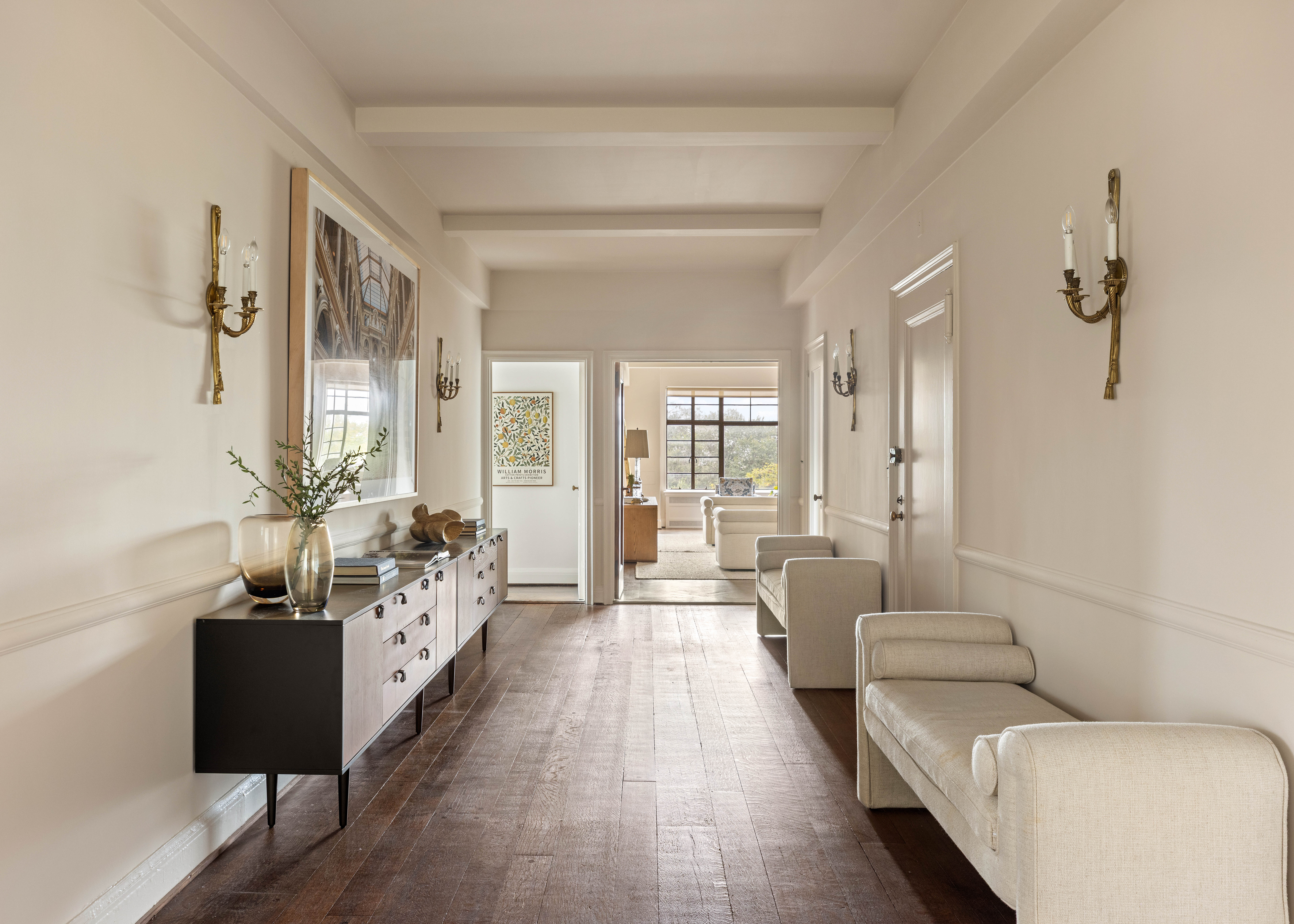 130 East End Avenue, Unit 8A Manhattan, NY 10028 - Photo 12 of 13 a living room with furniture and a chandelier