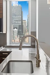 a kitchen with a sink and a window