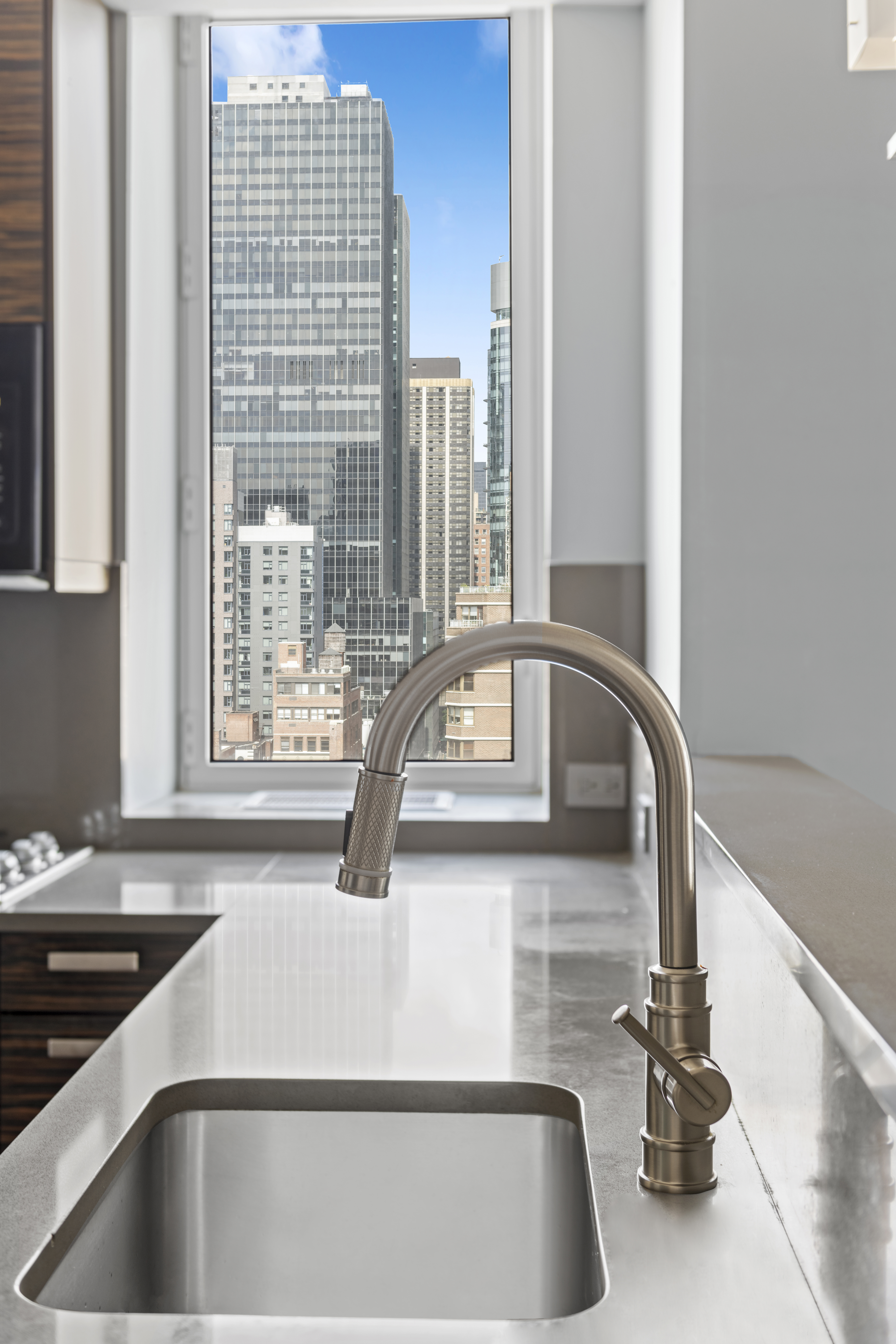 225 East 34th Street, Unit 17B Manhattan, NY 10016 - Photo 5 of 24 a kitchen with a sink and a window